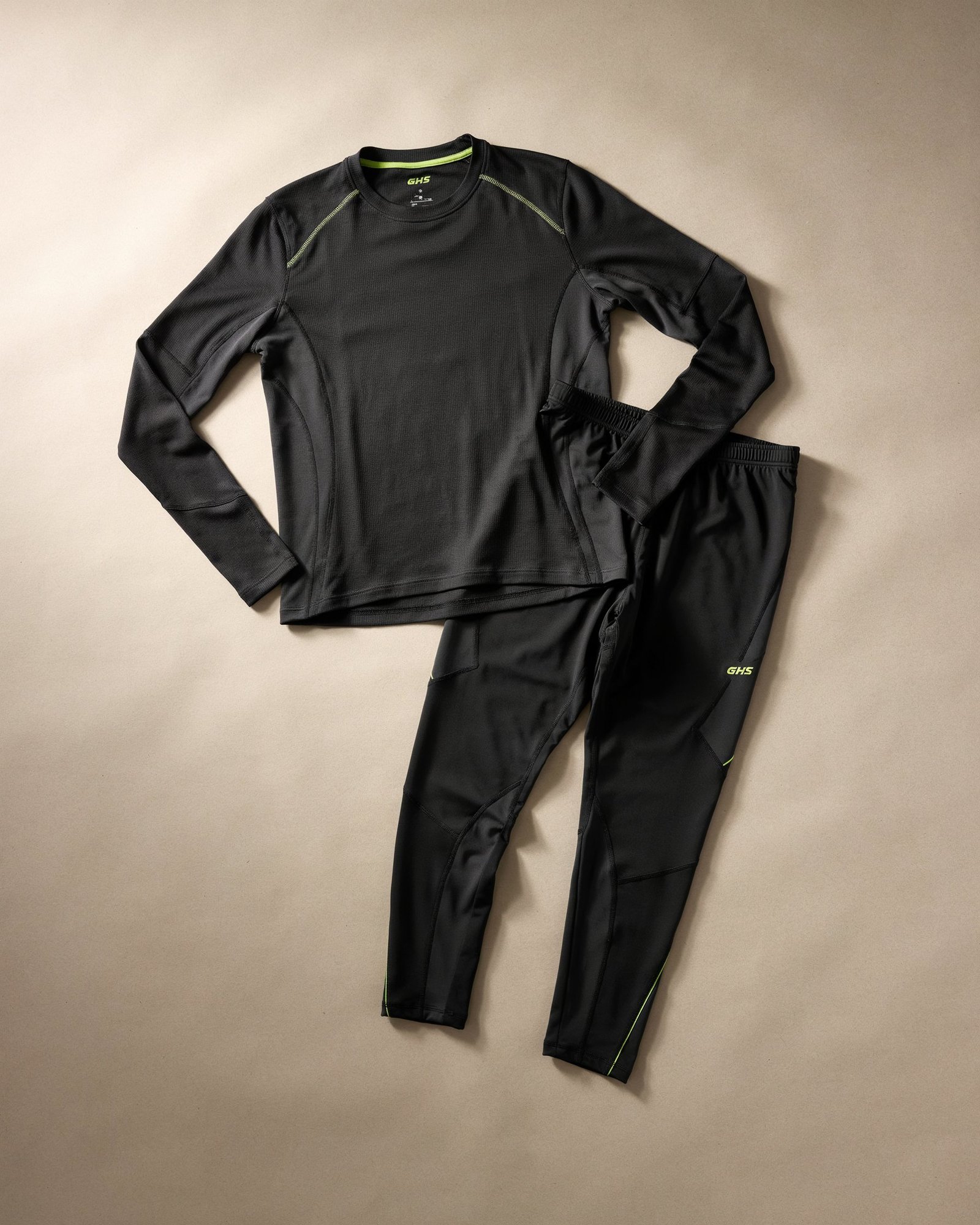 Custom graphite compression sportswear featuring a long-sleeve compression top and performance leggings
