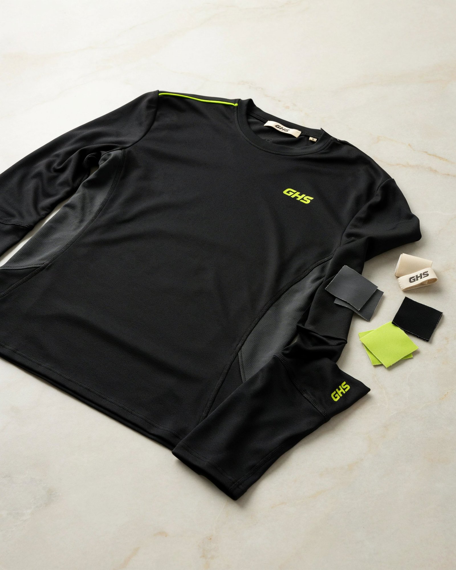 Custom GHS compression garment showing premium logo application, technical seams and private-label branding details